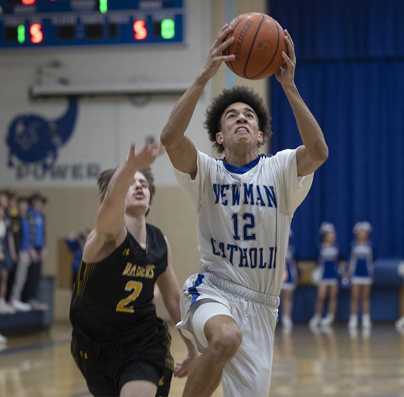 Newman’s Isaiah Williams go up for a score against AFC Monday, Feb. 19, 2024 in a regional quarterfinal game at Newman High School.