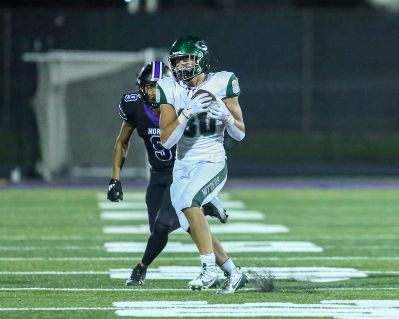 Glenbard West's Brady Johnson (80) makes a catch during a football game between Glenbard West at Downers Grove North on Friday, Sept 13th, 2024  in Downers Grove.