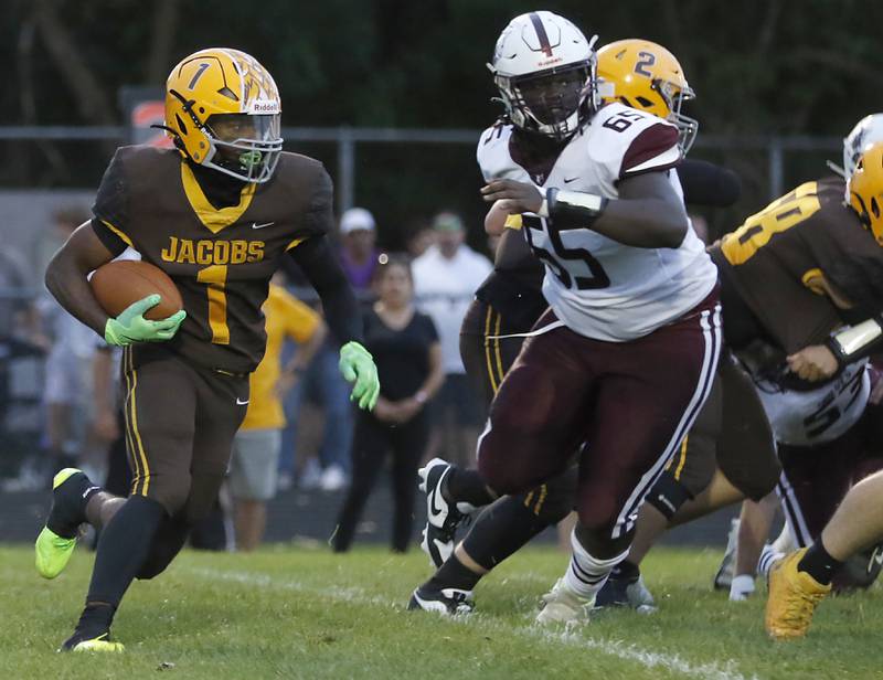 Jacobs' Tyvon Boddie runs with the ball during a Fox Valley Conference football game against Prairie Ridge on Friday, Aug 30, 2024, at Jacobs High School in Algonquin.