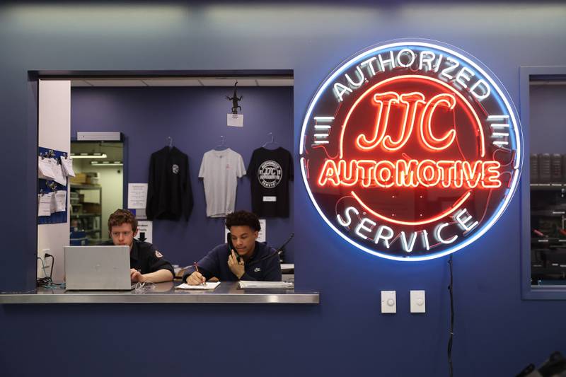 Jacob Winkler (left) and Aaron Graham work the service desk during Auto Service IV class at Joliet Junior College on Thursday, Feb. 1, 2024.