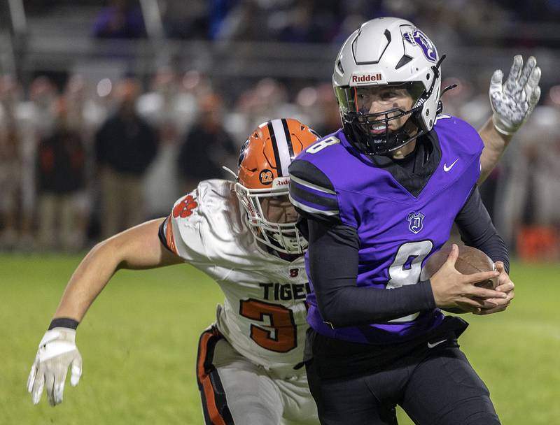 Dixon’s Tyson Dambman turns upfield after hauling in a pass against Byron Friday, Oct. 18, 2024, at A.C. Bowers Field in Dixon.