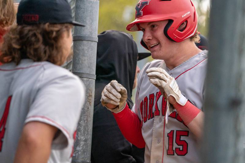 Yorkville's Nate Harris (15) smiles after hitting a homer against West Aurora during a baseball game at West Aurora High School on Monday, April 24, 2023.