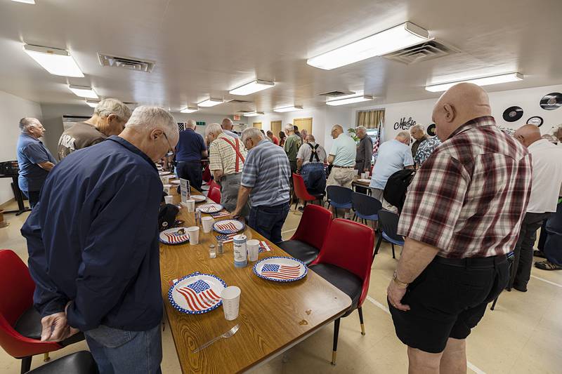 Veterans stand for the pledge of allegiance and a prayer Thursday, July 11, 2024.