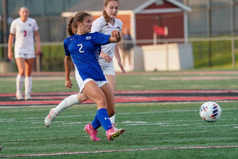 Geneva’s Cameron Bishop (2) shoots the ball against Glenbard East during a Class 3A Glenbard East Regional semifinal soccer match at Glenbard East High School in Lombard on Tuesday, May 14, 2024.