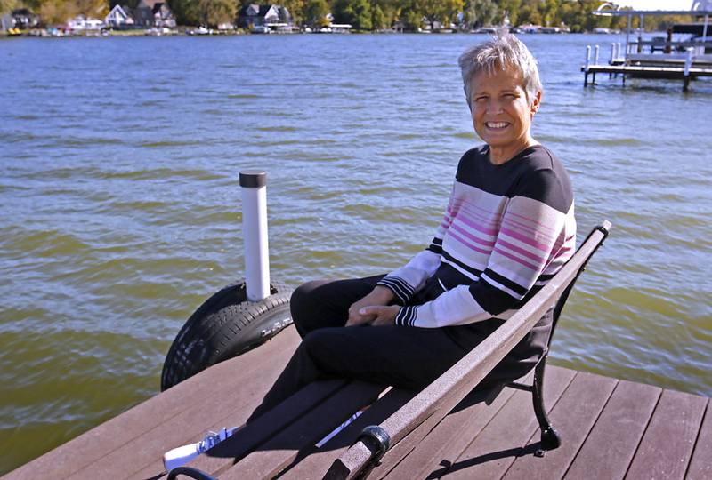 Debbie Koerber sits by the Fox River on Thursday, Oct. 17, 2024, at home in McHenry. Koerber, who will need a kidney one day, has made ads and cards in hopes of finding a donor.