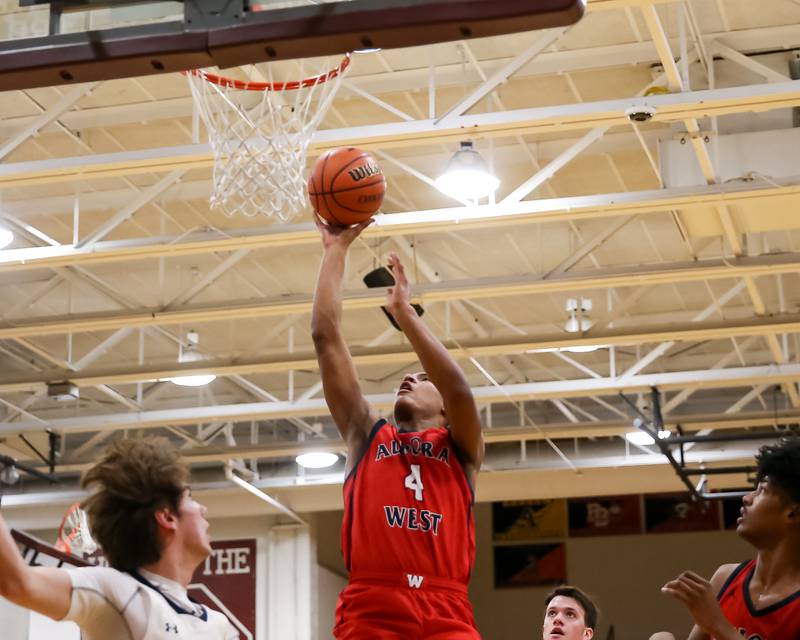 West Aurora's Josh Pickett (4) puts up a shot during Class 4A Lockport Regional final game between West Aurora at Oswego East.  Feb 24, 2023.