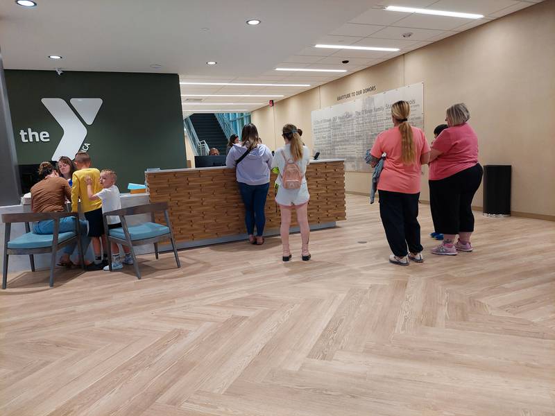 YMCA goers checked in at the front desk Monday, May 13, 2024, on the opening day of the new Ottawa YMCA.