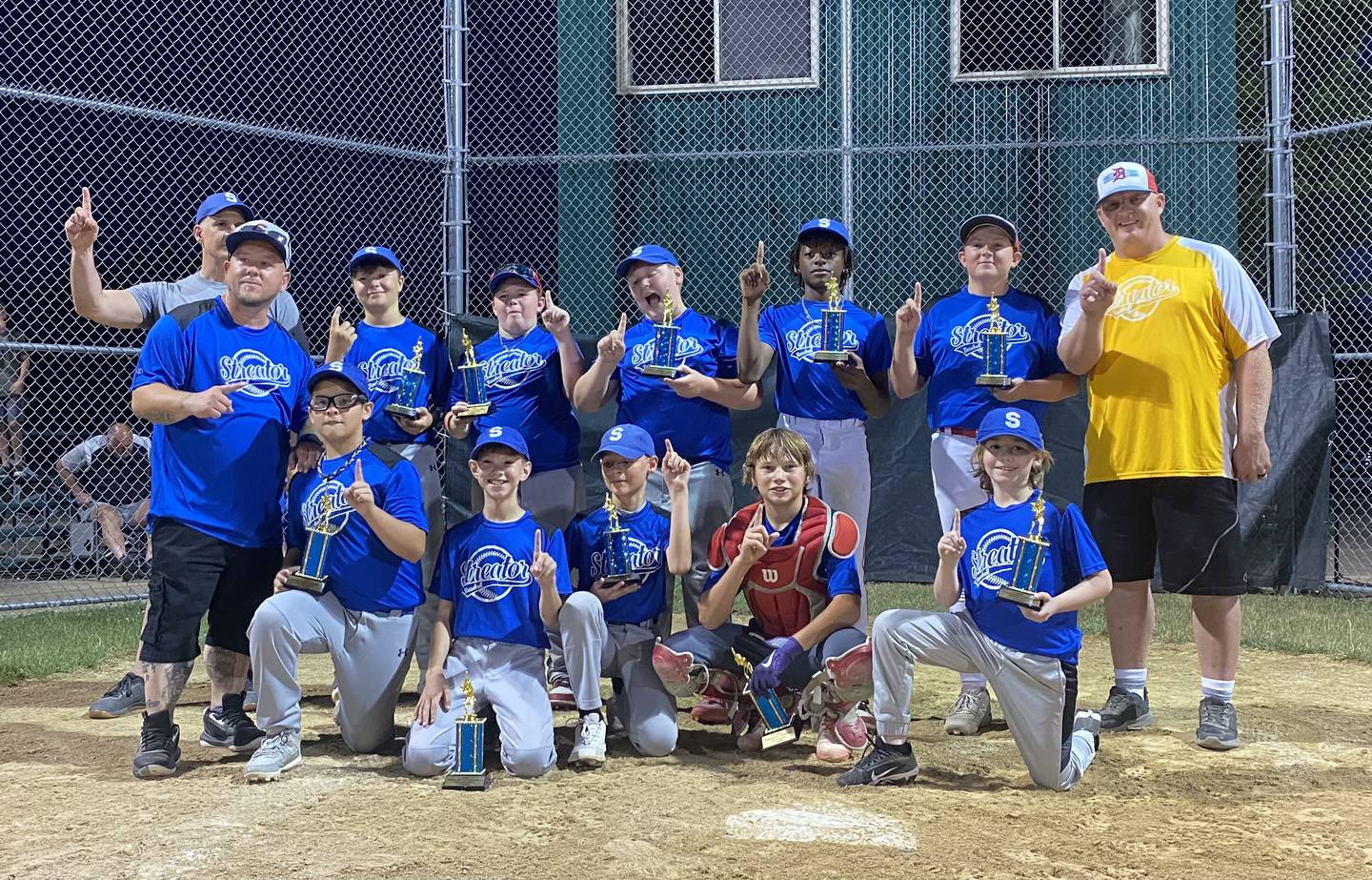 The freshly crowned Streator Little League Major (11-12) Division city champions, Hatzer & Son, pose at home plate with their trophies Wednesday, June 26, 2024, at Southside Park.
