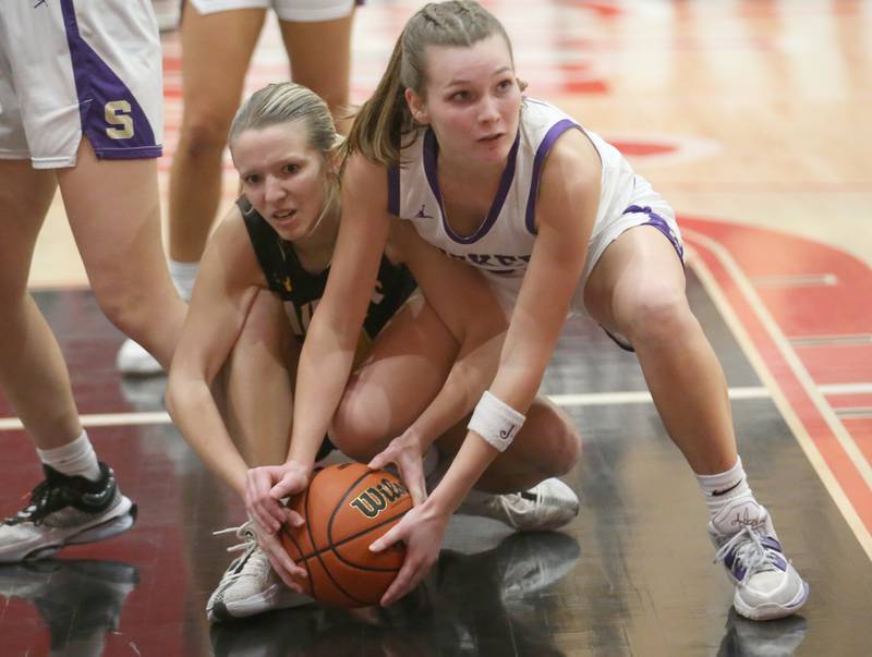 Ashton-Franklin Center's Taylor Jahn forces a jump ball with Serena's Jenna Setchell during the Class 1A Regional final on Thursday, Feb. 15, 2024 at Earlville High School.