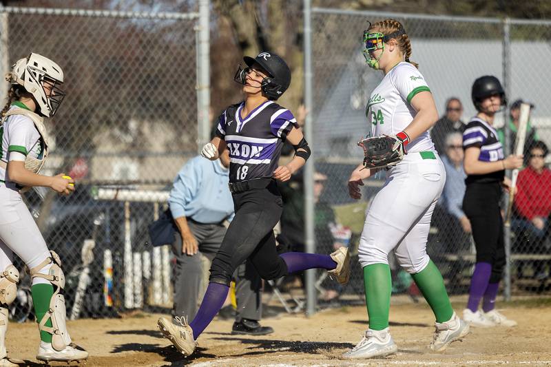 Dixon’s Bailey Tegeler comes in to score on a wild pitch against Rock Falls Tuesday, April 9, 2024 at Reynold’s field in Dixon.