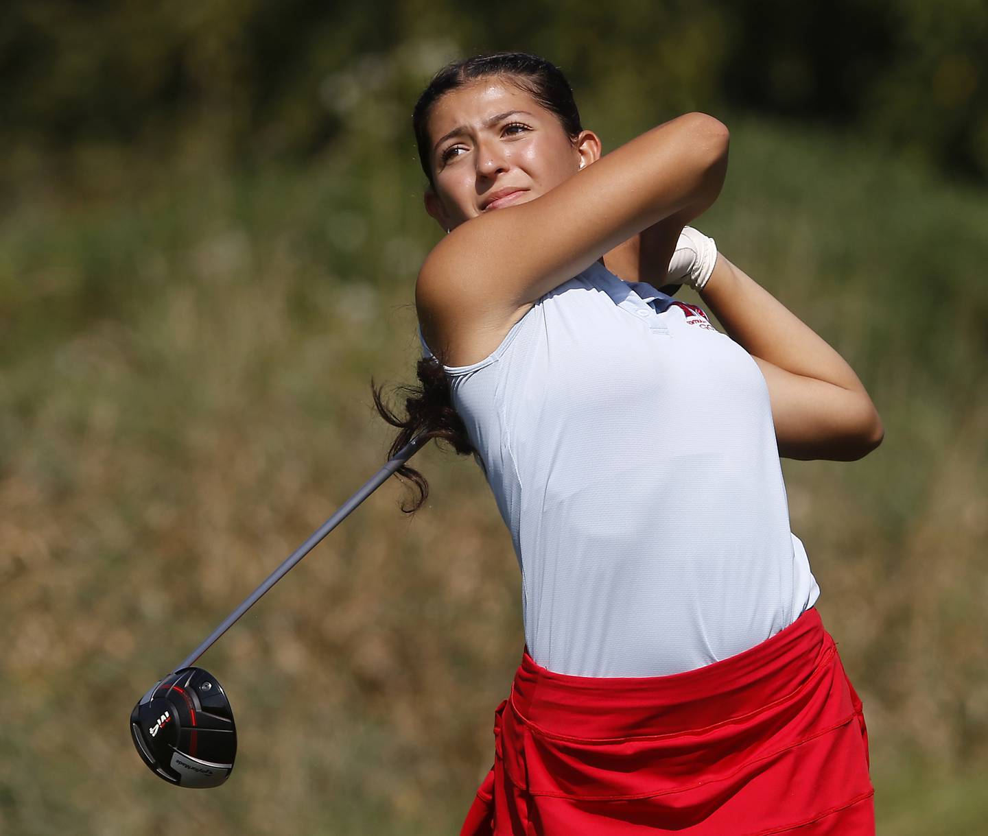 Marian Central’s Nina Notaro watches her tee shot on the 6th hole of the Valley course during the McHenry County Tournament on Thursday, Sept.12, 2024, at Boone Creek Golf Club in Bull Valley.