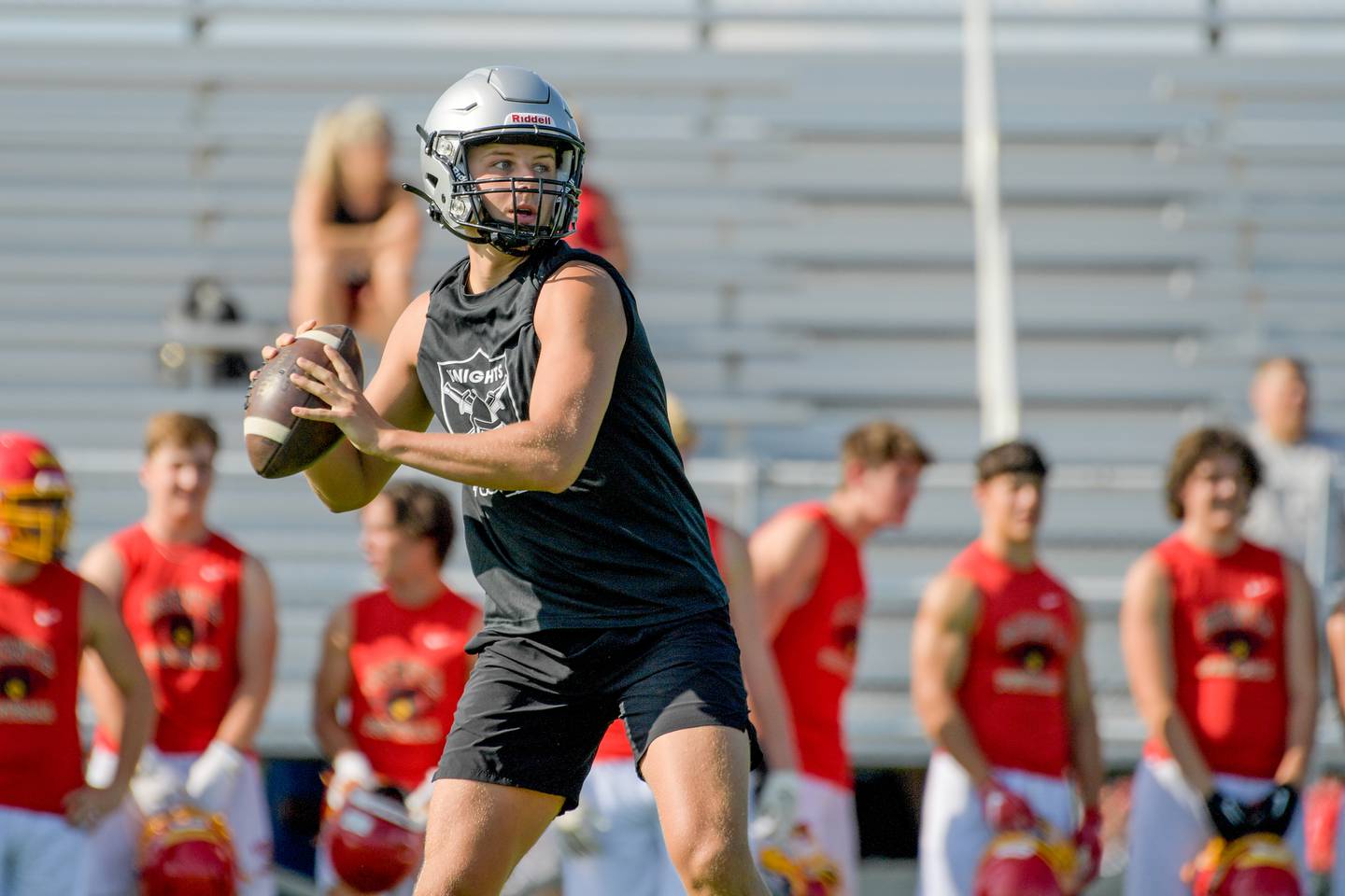 Kaneland quarterback Troyer Carlson looks for an open receiver during 7-on-7 football at against Batavia on Tuesday, July 18, 2023 in Maple Park.