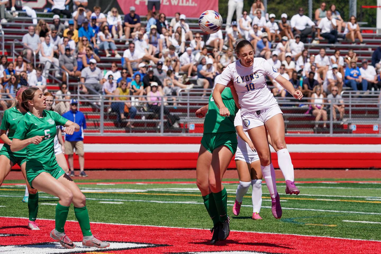 Lyons’ Caroline McKenna (10) goes up for a header agains York during a Class 3A Hinsdale Central Sectional girls soccer championship match at Hinsdale Central High School on Saturday, May 25, 2024.