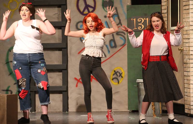 Madeline Enervold as Ronnette, Mia Raya as Crystal, and Jillian Younger as Chiffon acts out a scene during a rehearsal of  "The Little Shop of Horrors"  in the Mendota Community Theatre on Monday, June 17, 2024 at Mendota High School.