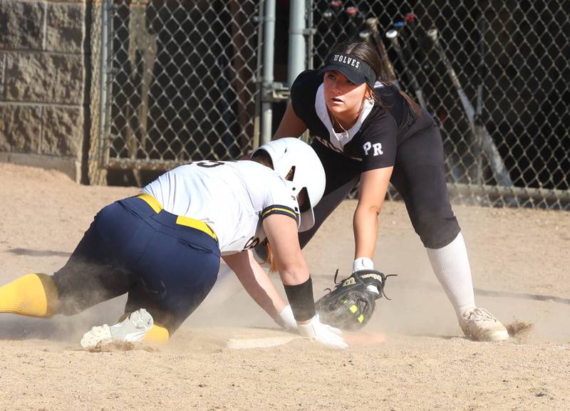 Sterling's Kennedy Tate just gets back ahead of the tag of Prairie Ridge's Mary Myers during their Class 3A sectional semifinal game Wednesday, May 29, 2024, at Sycamore High School.