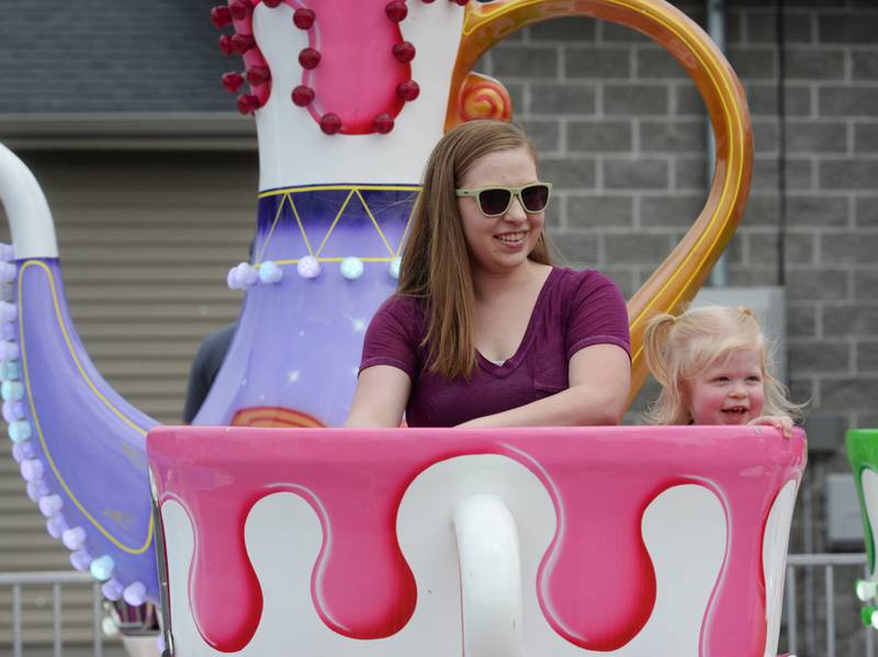 Kayla Schimetz and her daughter, Baylee, 2, of Stillman Valley, ride the Teacups at the ByronFest carnival on Saturday, July 13, 2024 in Byron.