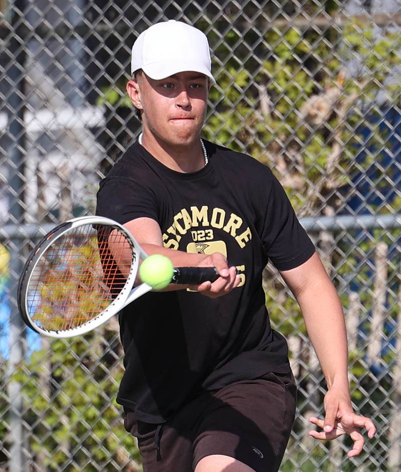 Sycamore number one doubles player Jonathan Locascio hits a forehand Wednesday, April 26, 2023, during their match against DeKalb at Sycamore High School.