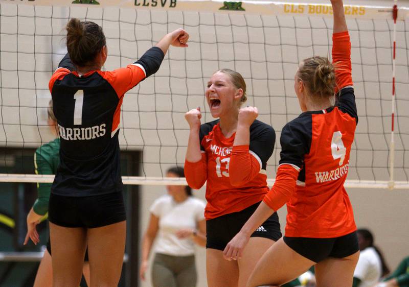 McHenry’s Kylie Chojnowski and the Warriors get revved up in varsity volleyball on Tuesday, Sept. 17, 2024, at Crystal Lake South High School in Crystal Lake.