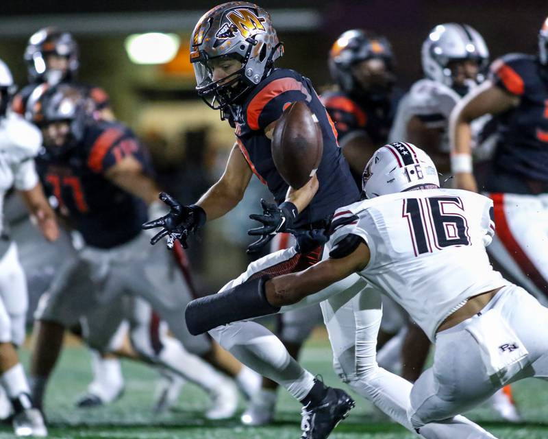 Plainfield North's Treycen Bownes (16) breaks up a pass intended for Minooka's Kameron Hopkins (8) during football game between Plainfield North at Minooka.   Oct 6, 2023.