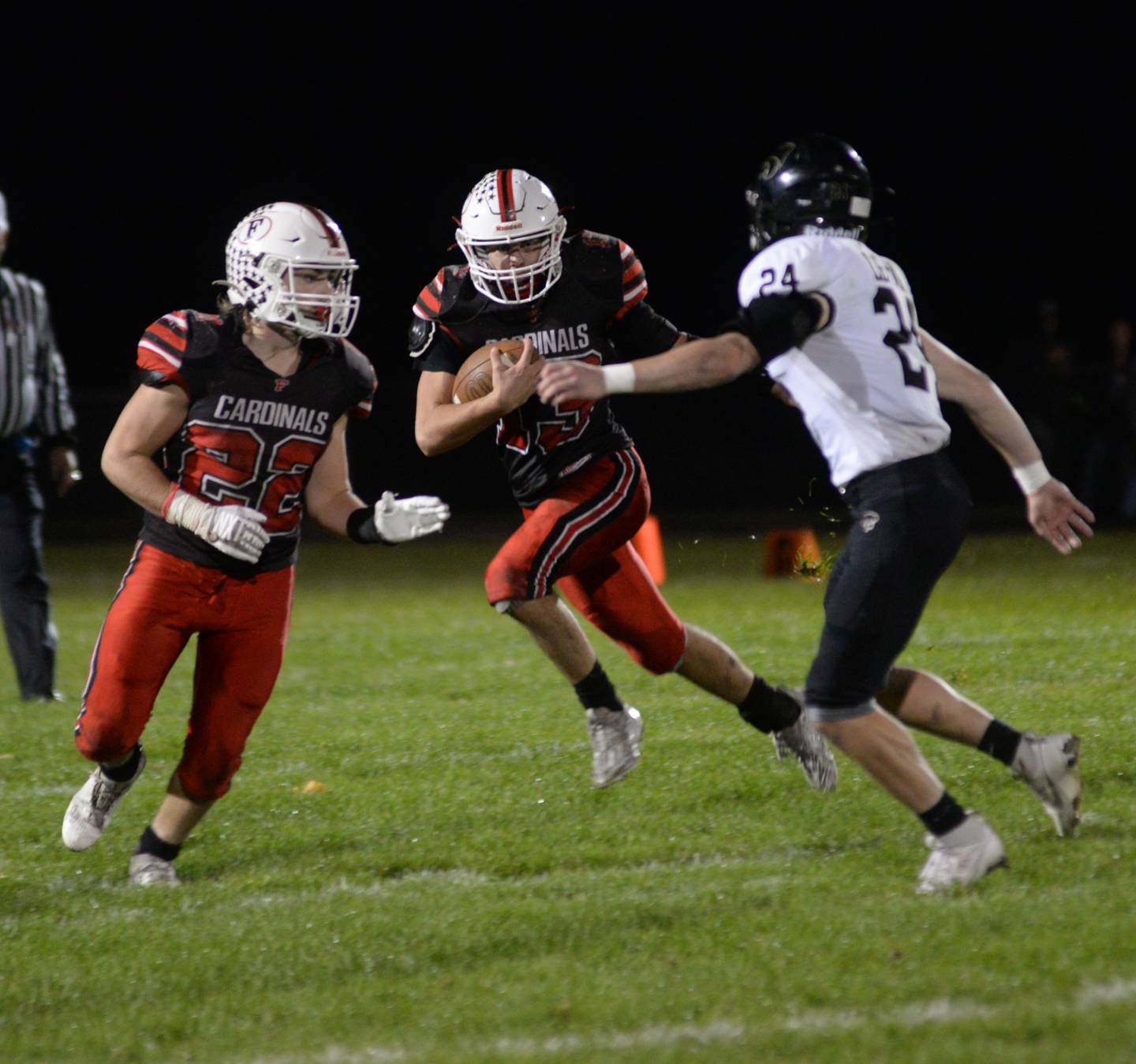 Forreston's Micah Nelson looks for a whole as Kaleb Sanders (22) blocks during Friday, Oct. 20, 2023 action against Lena-Winslow at Forreston High School.