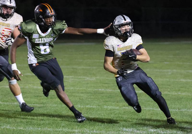 Kaneland's Dylan Sanagustin gets outside of DeKalb's Justin O’Neal during their game Friday, Sept. 13, 2024, at Kaneland High School in Maple Park.