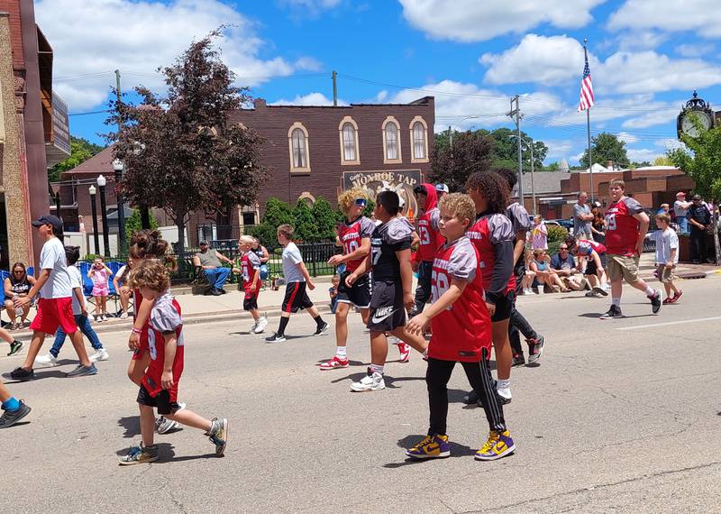 Streator Youth Football participants march Sunday, June 30, 2024, in the Liberty Fest parade in Streator.