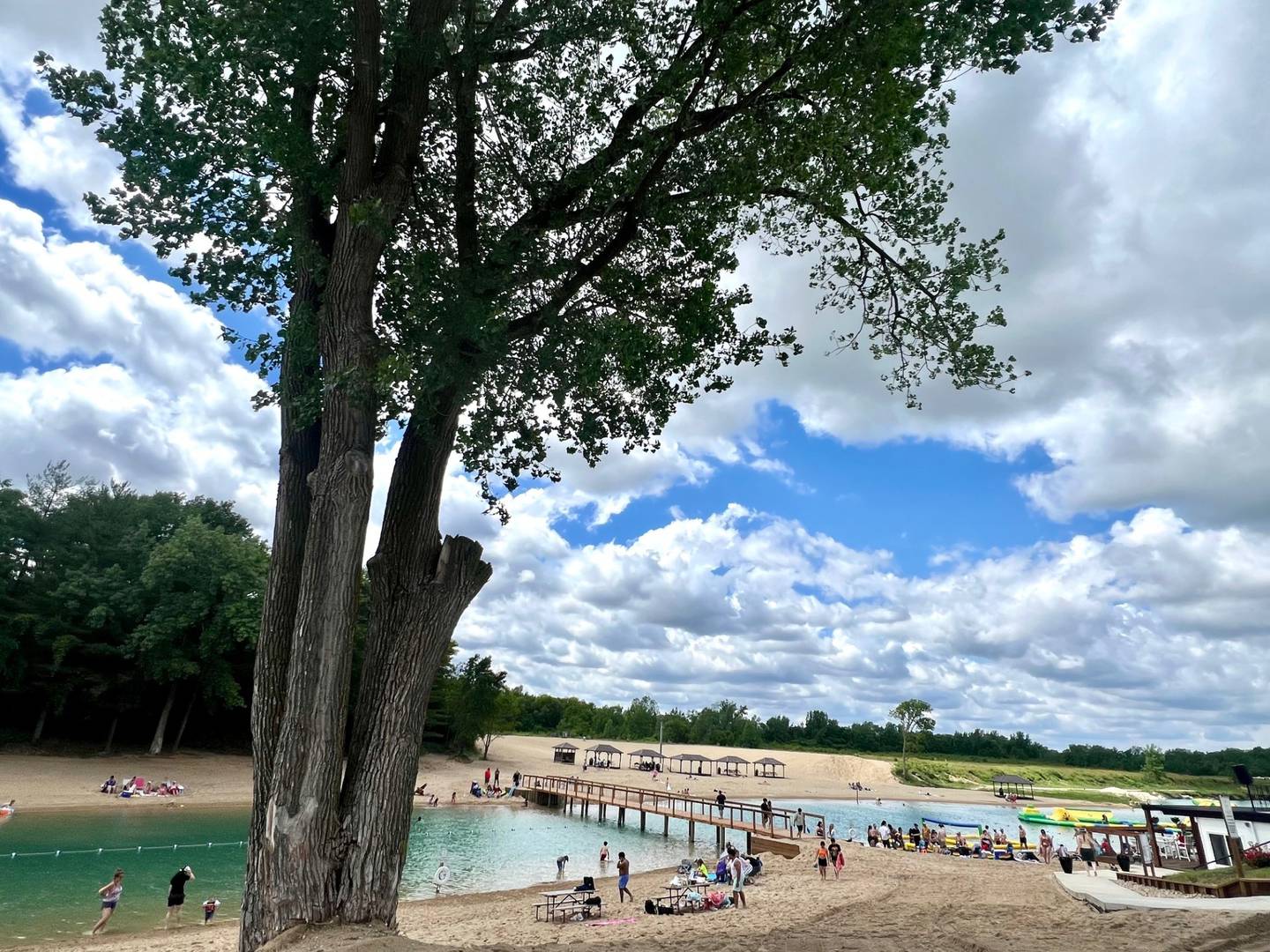 Pearl Lake Beach gets about 50-100 guests on weekdays and 300-1,000 on weekends. There is a clubhouse with a bar and ping pong table, an inflatable waterpark and more at the site.