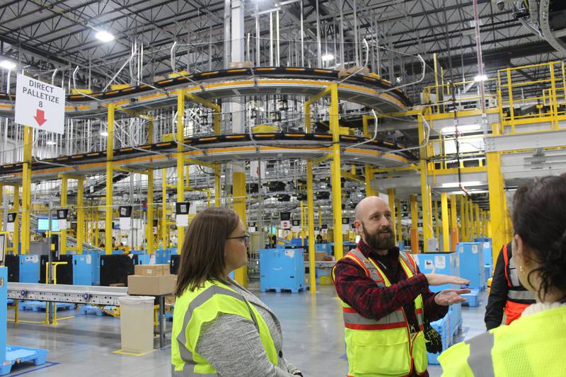 Amazon Operations Manager Brandon Tole tours the new Huntley facility on Wednesday, Feb. 28, 2024.