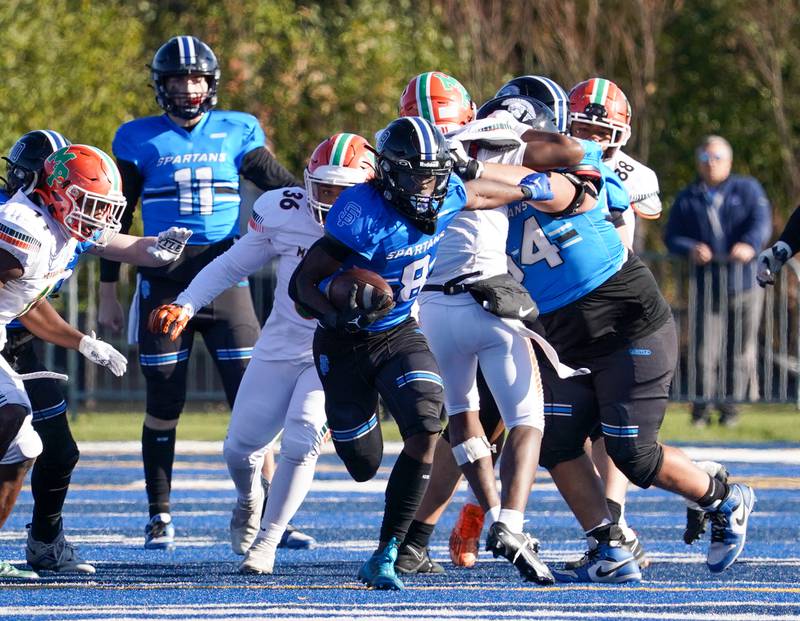 St. Francis' Tyvonn Ransom (8) runs after the catch against Morgan Park during a class 5A state quarterfinal football game at St. Francis High School in Wheaton on Saturday, Nov 11, 2023.