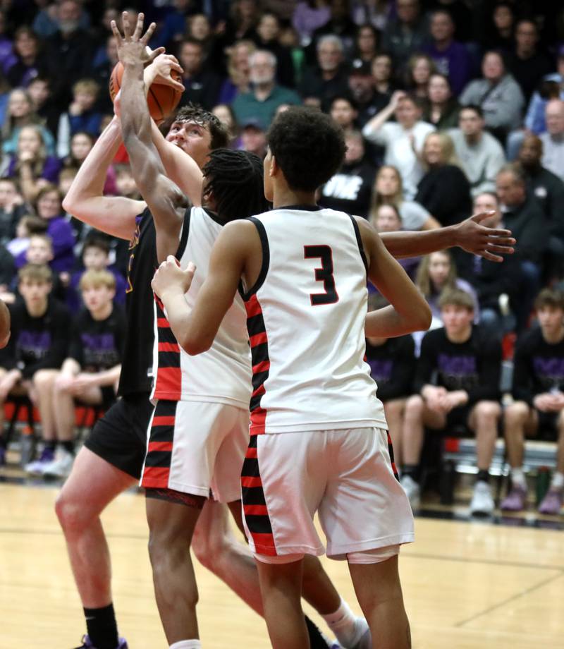 Downers Grove North’s Jake Riemer looks for an opening during the Class 4A East Aurora Boys Basketball Sectional final against Bolingbrook on Friday, March 1, 2024.