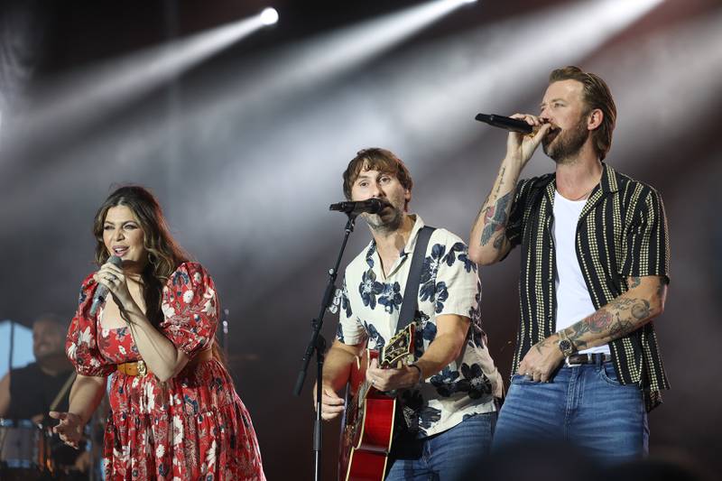 Hillary Scott, left, Dave Haywood and Charles Kelley of Lady A close out the night at the Taste of Joliet on Saturday, June 22, 2024 at Joliet Memorial Stadium.