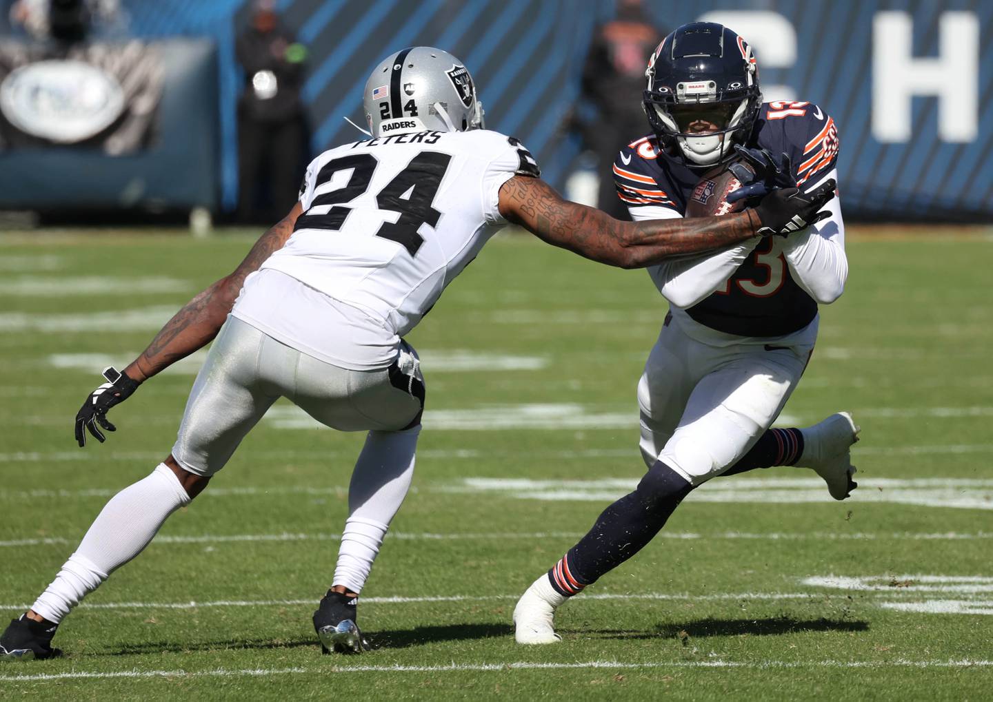 Chicago Bears wide receiver Tyler Scott tries to get by Las Vegas Raiders cornerback Marcus Peters during their game Sunday, Oct. 22, 2023, at Soldier Field in Chicago.