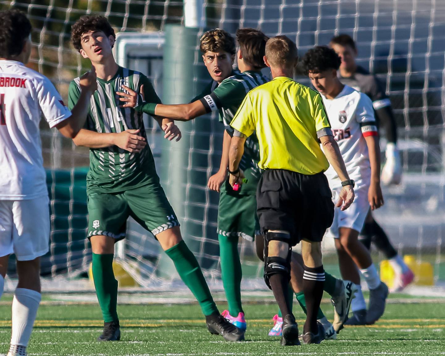 Plainfield Central's Abraham Contreras (4) pushes Henry Lambert (14) away from the ref during a soccer match between Bolingbrook and Plainfield Central on Tuesday, Sept. 3, 2024 in Plainfield.