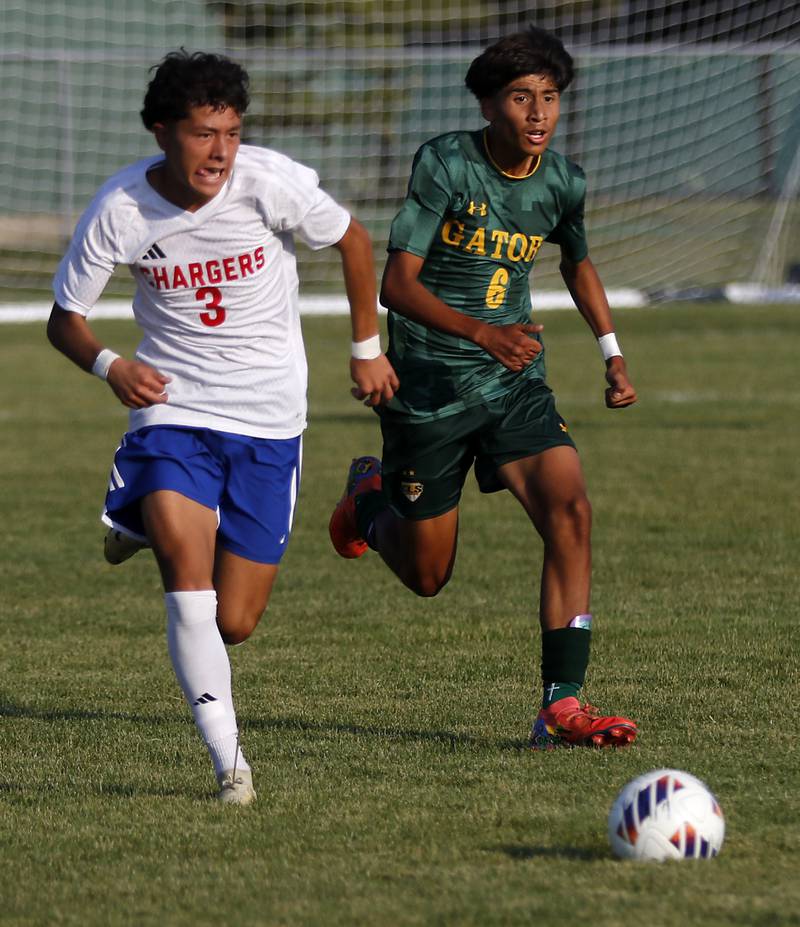 Dundee-Crown's Angel Landeros races against Crystal Lake South's Hayden Stone to the ball during a Fox Valley Conference soccer match on Tuesday, Sept. 10, 2024, at Crystal Lake South High School.