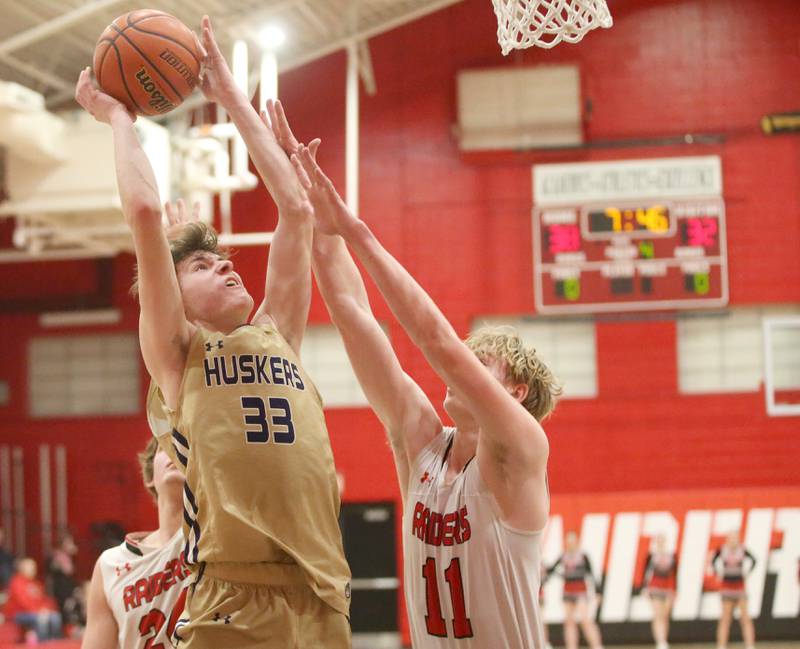 Serena's Hunter Staton eyes the hoop as Earlville's Adam Waite defends on Friday, Feb. 9, 2024 at Earlville High School.