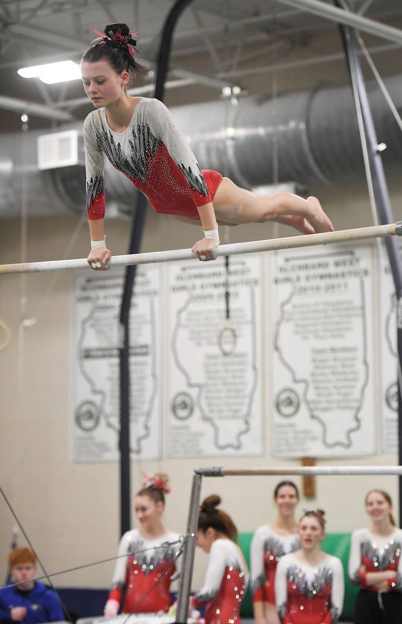 Glenbard East’s Mylee Janisch on the uneven parallel bars at the Glenbard West girls gymnastics regional meet in Glen Ellyn on Wednesday, January 31, 2024.