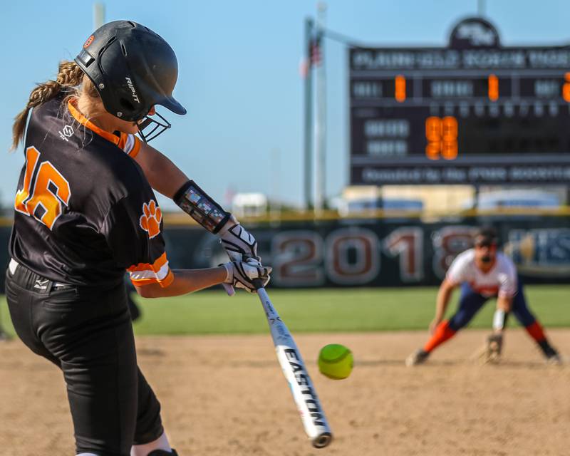 Wheaton-Warrenville South's Brooke Struebing (16) turns on a pitch during Class 4A Plainfield North Sectional semifinal softball game between Wheaton-Warrenville South at Oswego. May 29th, 2024.