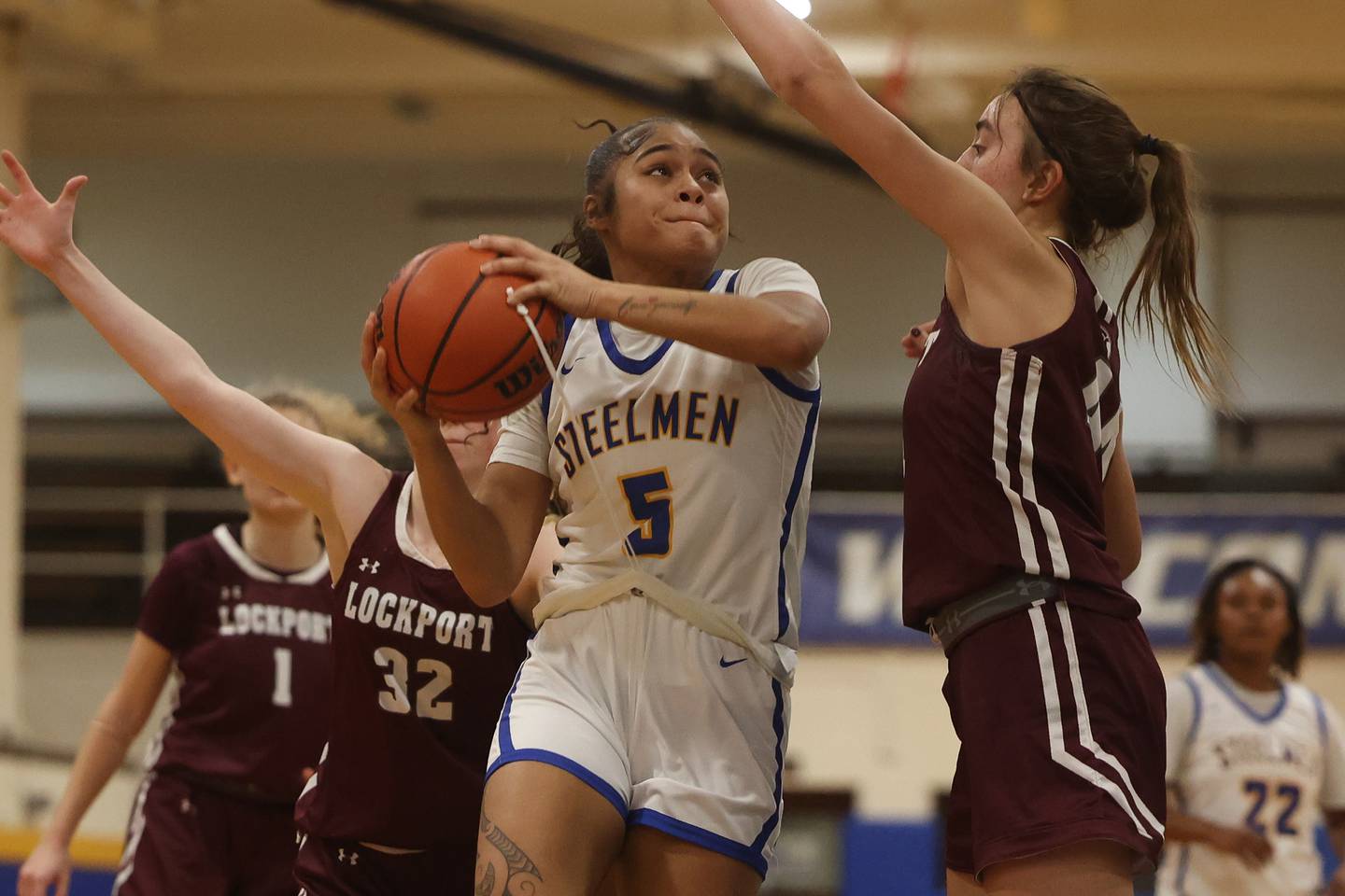 Joliet Central’s Joyce Tua-Link goes in for the basket against Lockport.