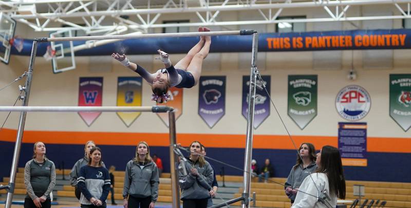 Oswego Co-op's Alenna Holden competes in the uneven bars during a Oswego Regional Gymnastics Meet at Oswego High School on Monday, Jan 29, 2024.