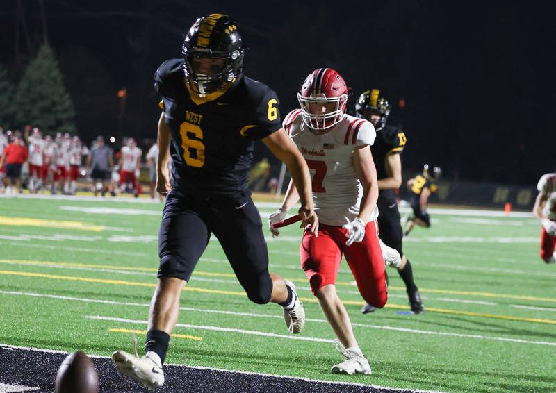 Joliet West’s punter Adrian Ramirez runs down the botched snap while being pursued by Yorkville’s Joe Freeman on Friday, Sept. 13, 2024 in Joliet.