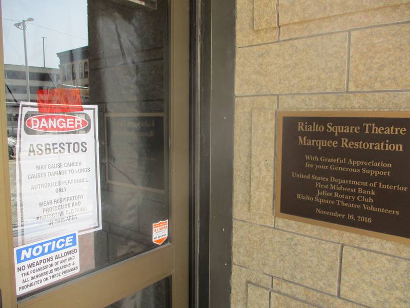 An asbestos warning is posted Wednesday on the front doors of the Rialto Square Theatre located at 102 N. Chicago St. in downtown Joliet. Sept. 11, 2024