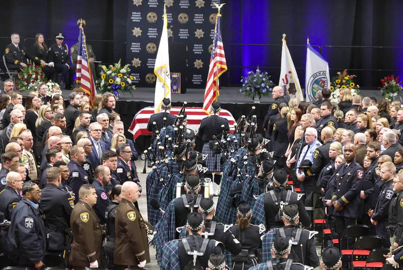 Bagpipers play Thursday, April 4, 2024, during the visitation and funeral for DeKalb County Sheriff’s Deputy Christina Musil in the Convocation Center at Northern Illinois University. Musil, 35, was killed March 28 while on duty after a truck rear-ended her police vehicle in Waterman.