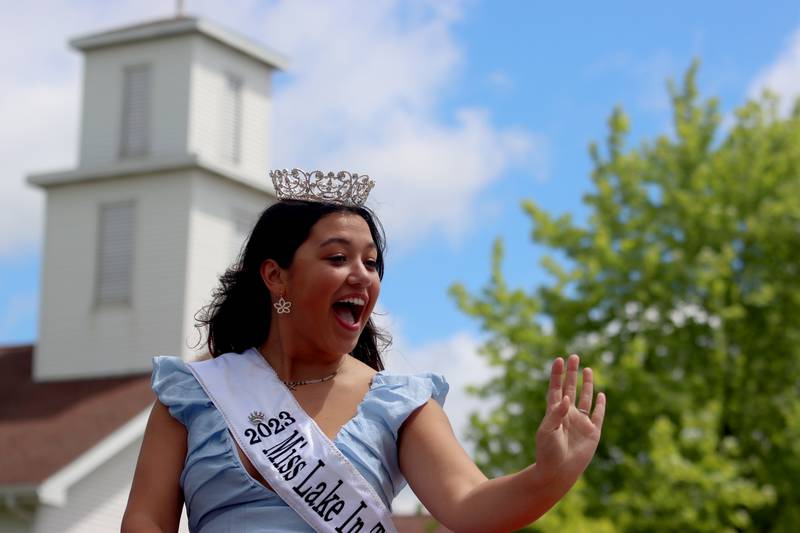 Miss Lake in the Hills 2023 Hallie Guerrero waves as she rides a float as part of the Huntley Memorial Day parade and observance Monday.