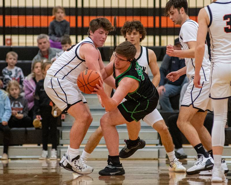 Rock Falls' Chevy Bates fights Byron's Caden Considine for control of the ball during the first quarter of the 2A Byron Regional championship game on Saturday, Feb. 25, 2023.