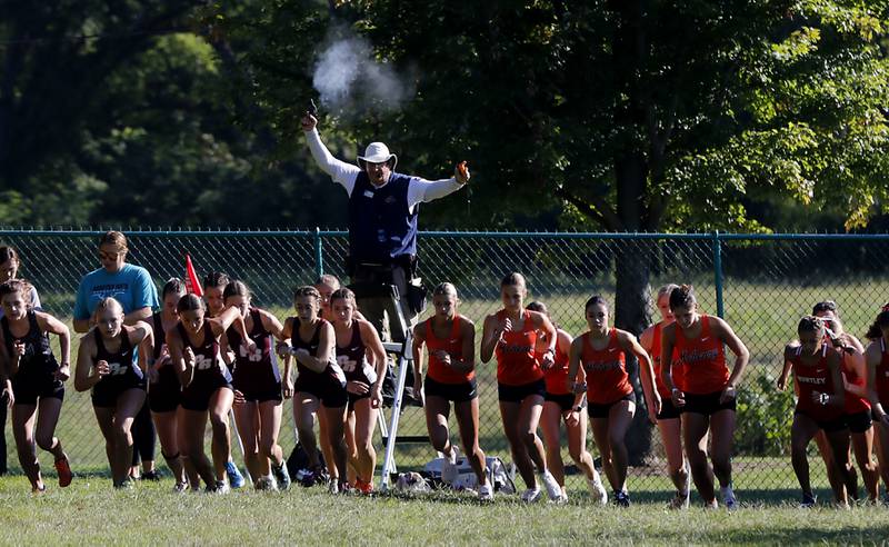 The gun ins fired to start the girls race of the McHenry County Cross Country Invite on Saturday, August 31, 2024, at McHenry Township Park in Johnsburg.