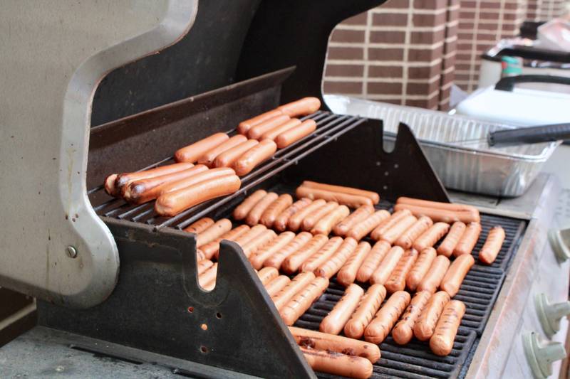 Propane grills were fired up and cooking hot dogs by the dozens on Friday at locations throughout Sterling for Hot Dog Day and Fun Fair. Dogs went for a quarter. There were also sidewalk sales, a car wash, and fun fair.