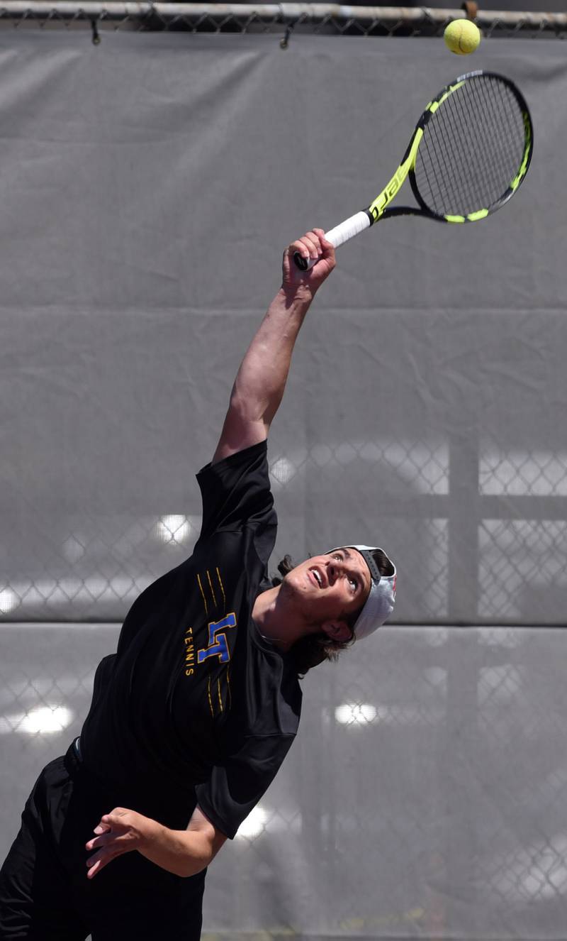 Lyons Township’s Mason Mazzone serves during the Class 2A doubles championship match of the boys state tennis tournament at Palatine High School on Saturday, May 25, 2024 in Palatine.