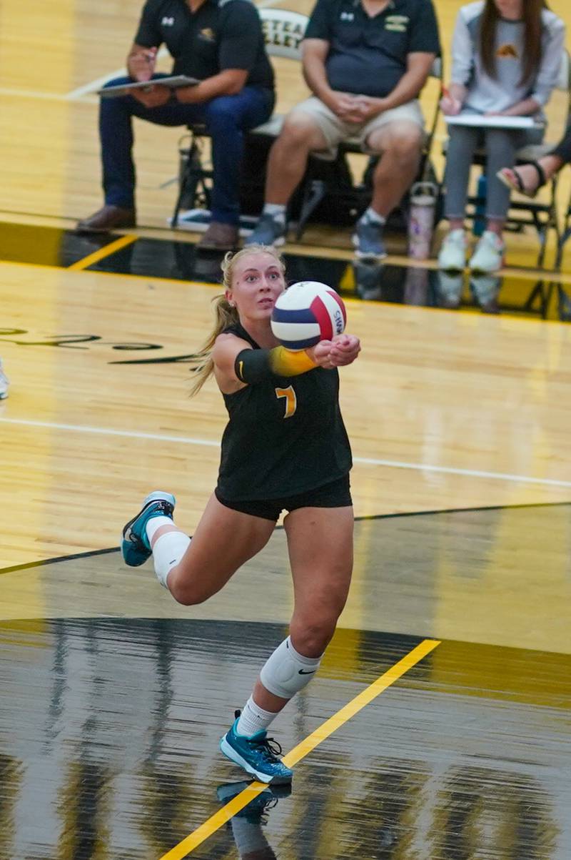 Metea Valley's Katie Schuele (7) bump sets the ball during a volleyball match against Benet at Metea Valley High School in Aurora on Wednesday, Sep 4, 2024.