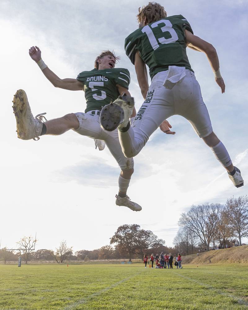 St. Bede's Callan Hueneburg (5) and teammate Ben Wallace (13) celebrate after scoring a touchdown against Forreston during the Class 1A first round playoff game on Saturday, Oct. 29, 2022 at the Academy in Peru.