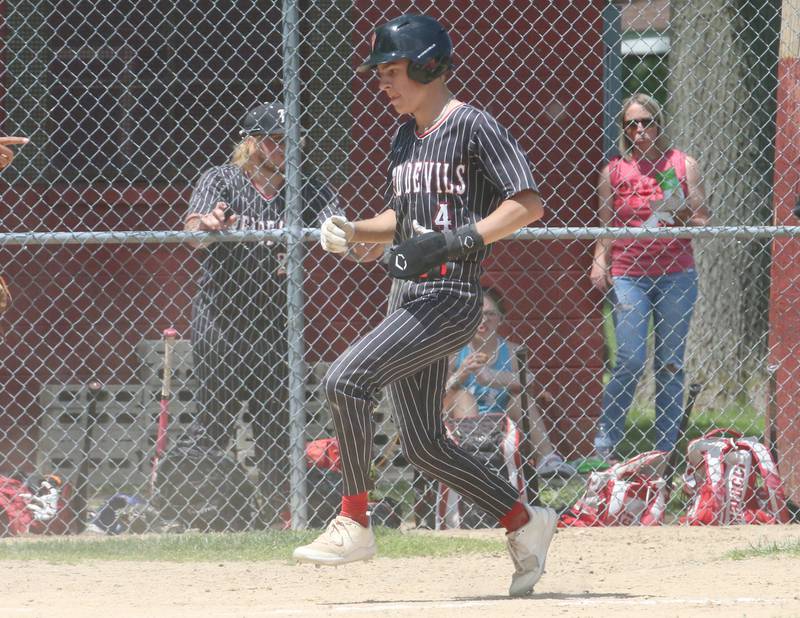 Hall's Luke Bryant reaches home against Chillicothe during the Class 2A Regional game on Saturday, May 18, 2024 at Kirby Park in Spring Valley.